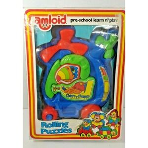Vintage  Amloid preschool learning rolling plastic puzzle in box helicopter bird